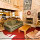 Family living room with fireplace in cabin 25 (Country Daze) , in Pigeon Forge, Tennessee.