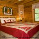 One of 5 country bedrooms in cabin 252 (Coal Miners Daughter) at Eagles Ridge Resort at Pigeon Forge, Tennessee.