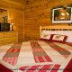 One of 5 country bedrooms in cabin 252 (Coal Miners Daughter) at Eagles Ridge Resort at Pigeon Forge, Tennessee.