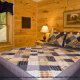 Country bedroom in cabin 252 (Coal Miners Daughter) at Eagles Ridge Resort at Pigeon Forge, Tennessee.