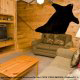 Country den with fireplace in cabin 252 (Coal Miners Daughter) at Eagles Ridge Resort at Pigeon Forge, Tennessee.