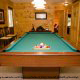Game room with a pool table in cabin 252 (Coal Miners Daughter) at Eagles Ridge Resort at Pigeon Forge, Tennessee.