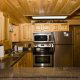 Country fully furnished kitchen in cabin 252 (Coal Miners Daughter) at Eagles Ridge Resort at Pigeon Forge, Tennessee.
