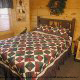Country bedroom in cabin 254 (Hibernation Hideaway) at Eagles Ridge Resort at Pigeon Forge, Tennessee.