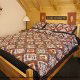 Country bedroom in cabin 254 (Hibernation Hideaway) at Eagles Ridge Resort at Pigeon Forge, Tennessee.
