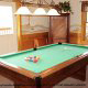 Game room with pool table in cabin 254 (Hibernation Hideaway) at Eagles Ridge Resort at Pigeon Forge, Tennessee.