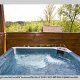 Deck with hot tub in cabin 255 (Happy Trails) at Eagles Ridge Resort at Pigeon Forge, Tennessee.