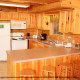 Country kitchen with bar in cabin 255 (Happy Trails) at Eagles Ridge Resort at Pigeon Forge, Tennessee.