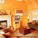 Living room with fireplace in cabin 255 (Happy Trails) at Eagles Ridge Resort at Pigeon Forge, Tennessee.