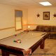 Game room with pool table in cabin 255 (Happy Trails) at Eagles Ridge Resort at Pigeon Forge, Tennessee.