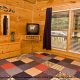Bedroom with Queen Size Bed in Cabin 257 (Mountain Charm) at Eagles Ridge Resort at Pigeon Forge, Tennessee.