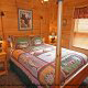 Country bedroom in cabin 258 (Sweet Memories) at Eagles Ridge Resort at Pigeon Forge, Tennessee.