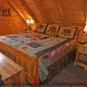 Country bedroom in cabin 258 (Sweet Memories) at Eagles Ridge Resort at Pigeon Forge, Tennessee.