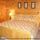 Country bedroom in cabin 259 (Country Charm) , in Pigeon Forge, Tennessee.