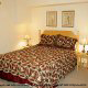 Country bedroom in cabin 259 (Country Charm) , in Pigeon Forge, Tennessee.