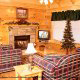 Living room with fire place in cabin 259 (Country Charm) , in Pigeon Forge, Tennessee.