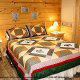 Country Bedroom View of Cabin 261 (Smoky Mountain High) at Eagles Ridge Resort at Pigeon Forge, Tennessee.