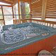Relax in this soothing hot tub in Cabin 27, (Bear Naked), in Pigeon Forge, Tennessee.