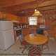 Furnished pine kitchen in Cabin 27, (Bear Naked), in Pigeon Forge, Tennessee.