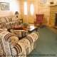 Warm living room to curl up in in cabin 30 (Mountain Refuge), in Pigeon Forge, Tennessee.