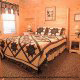 Country Bedroom View of Cabin 302 (Best Of Times) at Eagles Ridge Resort at Pigeon Forge, Tennessee.