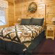 Country bedroom in cabin 304 (Southern Hospitality) at Eagles Ridge Resort at Pigeon Forge, Tennessee.