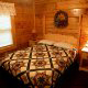 Country bedroom in cabin 304 (Southern Hospitality) at Eagles Ridge Resort at Pigeon Forge, Tennessee.