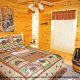Country bedroom in cabin 305 (Bear Right In) at Eagles Ridge Resort at Pigeon Forge, Tennessee.