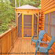 Back porch with hot tub in cabin 305 (Bear Right In) at Eagles Ridge Resort at Pigeon Forge, Tennessee.