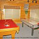 Game room with pool table in cabin 305 (Bear Right In) at Eagles Ridge Resort at Pigeon Forge, Tennessee.