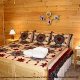 Country bedroom in cabin 306 (A Smoky Mountain Dream) , in Pigeon Forge, Tennessee.
