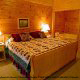 Country bedroom in cabin 314 (Yall Come Back Now Ya Hear) , in Pigeon Forge, Tennessee.