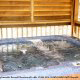 Hot tub on porch in cabin 316 (Black Bear Hideaway) , in Pigeon Forge, Tennessee.