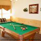 Game room with pool table in cabin 316 (Black Bear Hideaway) , in Pigeon Forge, Tennessee.
