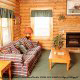 Put your feet up in the den to rest in cabin 32 (Country Delight), in Pigeon Forge, Tennessee.