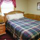 Country Bedroom View of Cabin 33 (Ganmas Getaway) at Eagles Ridge Resort at Pigeon Forge, Tennessee.