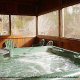 Hot Tub on Deck in Cabin 33 (Ganmas Getaway) at Eagles Ridge Resort at Pigeon Forge, Tennessee.