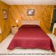 Bedroom with Bathroom Tub in Cabin 34 (Little Rocky Top) at Eagles Ridge Resort at Pigeon Forge, Tennessee.