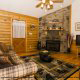 Den View with Fire Place of Cabin 37 (Hi Bear Nate) at Eagles Ridge Resort at Pigeon Forge, Tennessee.