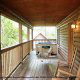 Rock yourself to sleep on this large porch in cabin 38R (Country Romance), in Pigeon Forge, Tennessee.