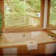 Relax in this jacuzzi with nature surrounding you and enjoy the wilderness  in cabin 38R (Country Romance), in Pigeon Forge, Tennessee.