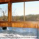 Hot tub on deck with a view of nature in cabin 4 (Eagles Paradise) , in Pigeon Forge, Tennessee.
