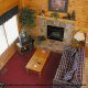 Living room with vaulted ceilings and fireplace in cabin 4 (Eagles Paradise) , in Pigeon Forge, Tennessee.