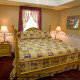 Roomy bedroom with a comfortable bed to wake up rested in cabin 40 (Bear Pause), in Pigeon Forge, Tennessee.