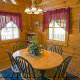 Clean and quaint furnished dining room  in cabin 40 (Bear Pause), in Pigeon Forge, Tennessee.