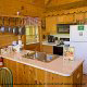 This open kitchen style makes it easy to communicate in cabin 40 (Bear Pause), in Pigeon Forge, Tennessee.