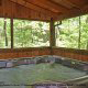 Porch with hot tub in cabin 41 (Tennessee Mountain Memories) , in Pigeon Forge, Tennessee.