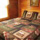 Bedroom with King Size Bed in Cabin 47 (Moody Blue) at Eagles Ridge Resort at Pigeon Forge, Tennessee.