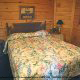 Cozy mid size country bedroom in cabin 50 (Creekside), in Pigeon Forge, Tennessee.