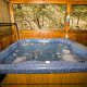 Night or day enjoy the soothing hot tub with a view of nature in cabin 51 (Natures Grace Retreat), in Pigeon Forge, Tennessee.
